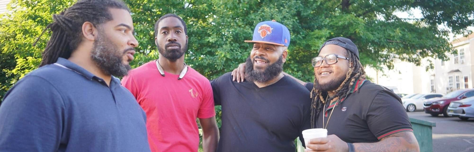 Caleb and his older brother Charles Love, MHS, outdoors with friends on a summer day