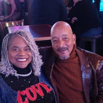 Cassandra Love, LPC, and Charles Love, Peer Recovery Specialist, together in a family photograph
